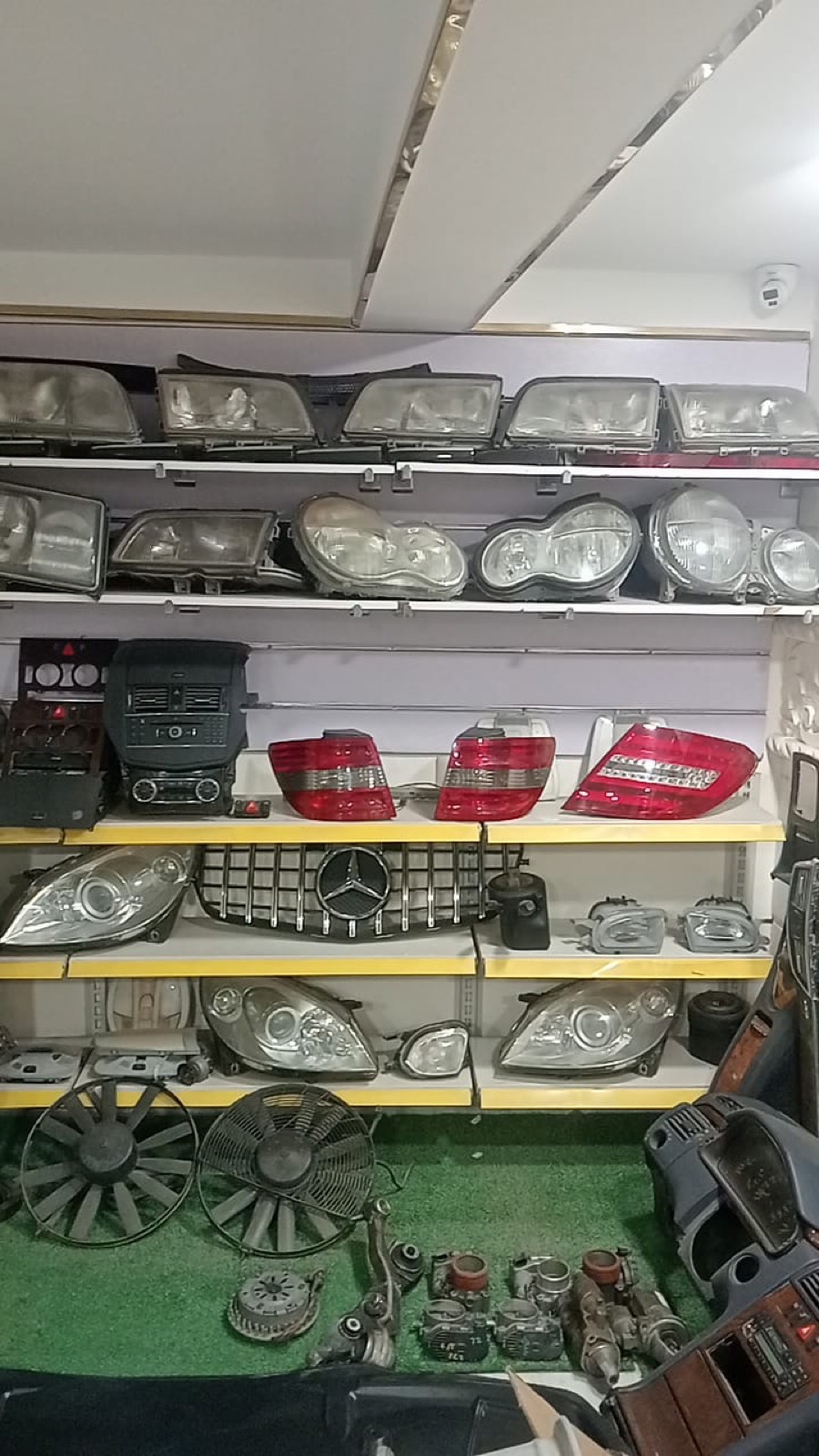 Rows of Mercedes tail lights stocked on shelves